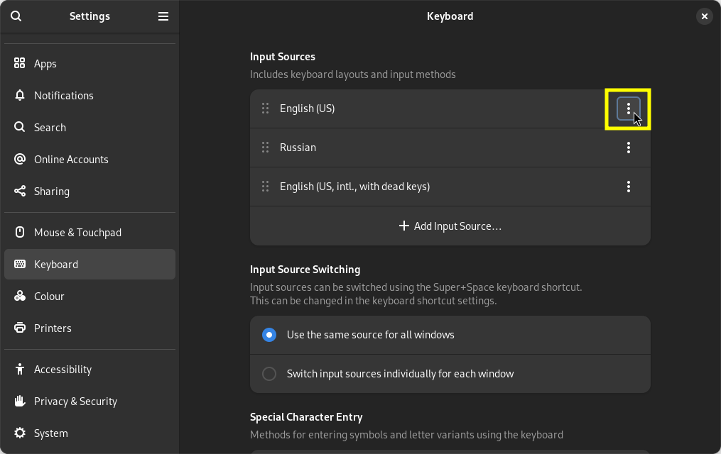 GNOME keyboard settings page with three layouts: English (US), Russian, and English (US, intl., with dead keys)
